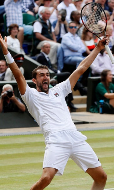 The Latest: Spectator goes on court to face Clijsters serve